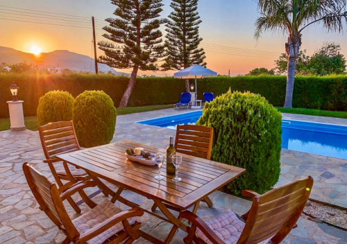 Villa Aphrodite pool area at sunset